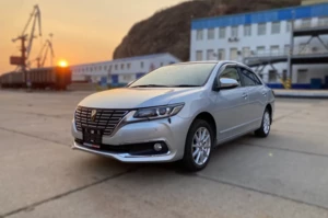 Toyota Premio T260 на фоне заката